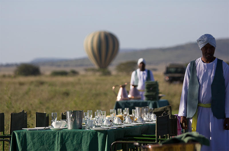 Hot air balloon floating over the Serengeti at sunrise — Tanzania balloon safari by THE TANZANIA LUXURY SAFARIS